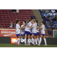 Ottawa Rapid FC celebrate a goal against Calgary Wild FC