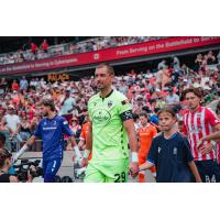 Atlético Ottawa goalkeeper Nathan Ingham hits the pitch
