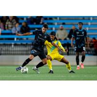 Colorado Springs Switchbacks FC with possession against New Mexico United