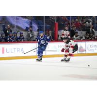 Syracuse Crunch right wing Ethan Gauthier (left) vs. the Utica Comets