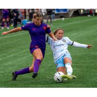 Calgary Wild FC fight for possession with AFC Toronto