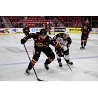 Moose Jaw Warriors' Brady Ness and Vancouver Giants' Blake Chorney in action