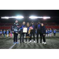 Desiree Scott is honored on the field by Ottawa Rapid FC