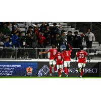 Phoenix Rising's Charlie Dennis, Hope Avayevu, Collin Smith, and Jean-Éric Moursou on game night