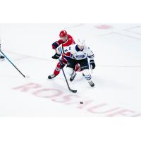 Spokane Chiefs' Brody Gillespie and Wenatchee Wild's Josh Fluker in action