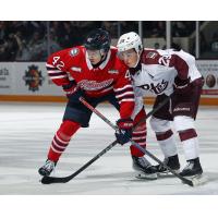 Peterborough Petes centre Braydon McCallum (right) vs. the Oshawa Generals