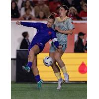 Calgary Wild FC fights for possession vs. Vancouver Rise FC