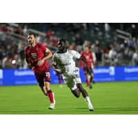 Rhode Island FC forward Albert Dikwa (right) vs. North Carolina FC