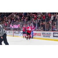 Adirondack Thunder gather after a goal in front of a sellout crowd