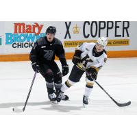 Peterborough Petes defenceman Genc Ula (left) vs. the Kingston Frontenacs