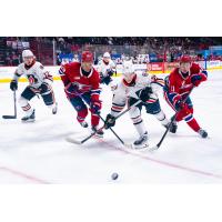 Spokane Chiefs fight for the puck against the Kamloops Blazers