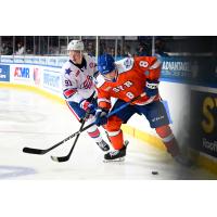 Syracuse Crunch defenseman Tommy Miller (right) vs. the Rochester Americans