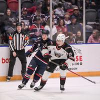 Tri-City Americans' Connor Dale and Vancouver Giants' Tobias Tomik on the ice