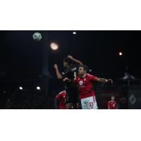 FC Tulsa's Taylor Calheira and Phoenix Rising's Rafael Czichos in action