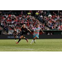 San Diego Wave FC midfielder Gia Corley (right) vs. the Portland Thorns