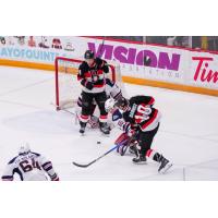 Belleville Senators centre Philippe Daoust shoots while Jan Jeník screens the goaltender