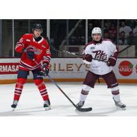 Peterborough Petes centre Kaden McGregor (right) vs. the Oshawa Generals