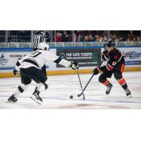 Wichita Thunder defenseman Noah Beck (left) faces the Kansas City Mavericks