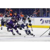 Worcester Railers forward Ross Mitton (right) races for the puck
