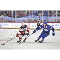 Syracuse Crunch center Tristan Allard (right) vs. the Utica Comets