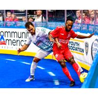 St. Louis Ambush battle for possession with the Kansas City Comets