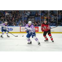 Syracuse Crunch's Nick Abruzzese and Utica Comets' Topias Vilén on the ice