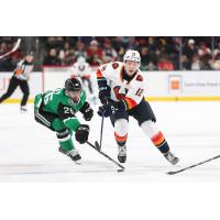 Texas Stars defenseman Michael Karow (left) vs. the Coachella Valley Firebirds