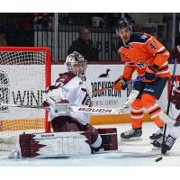 Peterborough Petes goaltender Easton Rye tips aside a Flint Firebirds' shot