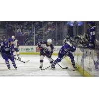 Syracuse Crunch defenseman Simon Lundmark (far right) vs. the Cleveland Monsters