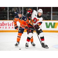 Flint Firebirds defenseman Urban Podrekar (left) vs. the Ottawa 67's