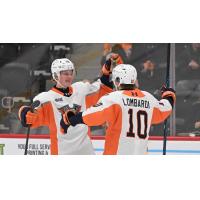 Flint Firebirds exchange congratulations following a goal