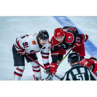 Rapid City Rush forward Blake Bennett (left) faces off with the Allen Americans