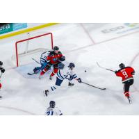 Kelowna Rockets centre Shane Smith (right) takes a shot against the Penticton Vees
