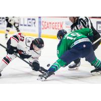Adirondack Thunder forward Grant Loven (left) faces off with the Maine Mariners