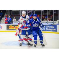 Syracuse Crunch left wing Nick Abruzzese (right) vs. the Rochester Americans