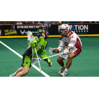 Oshawa Firewolves defender Nick Chaykowsky (right) vs. the Saskatoon Blades