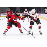 Belleville Senators left wing Jamieson Rees (right) vs. the Utica Comets