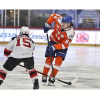 Syracuse Crunch center Conor Geekie (right) vs. the Utica Comets