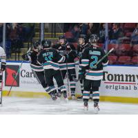 Kelowna Rockets gather after a goal