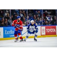Syracuse Crunch defenseman Matteo Pietroniro (right) vs. the Laval Rocket