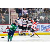 Adirondack Thunder huddle after a score against the Maine Mariners