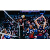 Grand Rapids Rise setter Camryn Turner (left) and middle blocker Alyssa Jensen