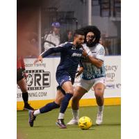 Tacoma Stars' Michael Ramos and St. Louis Ambush's Robert Williamson in action