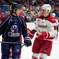 Allen Americans left wing Colby McAuley (right) has a discussion with the Tulsa Oilers