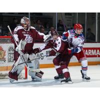 Peterborough Petes goaltender Easton Rye and defenceman Garrett Frazer vs. the Kitchener Rangers