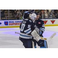 Penticton Vees goaltender Ethan McCallum is congratulated by Andrew Reyelts