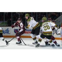 Peterborough Petes left wing Brennan Faulkner (left) vs. the North Bay Battalion