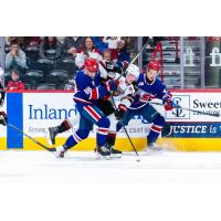 Vancouver Giants left wing Luca Pura sandwiched by the Spokane Chiefs