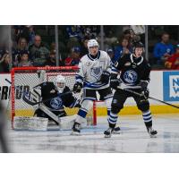 Wenatchee Wild's Cal Conway and Sam Elliott and Victoria Royals' Reggie Newman on game night