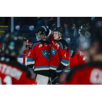 Kelowna Rockets defenceman Mazden Leslie congratulates goaltender Harrison Boettiger